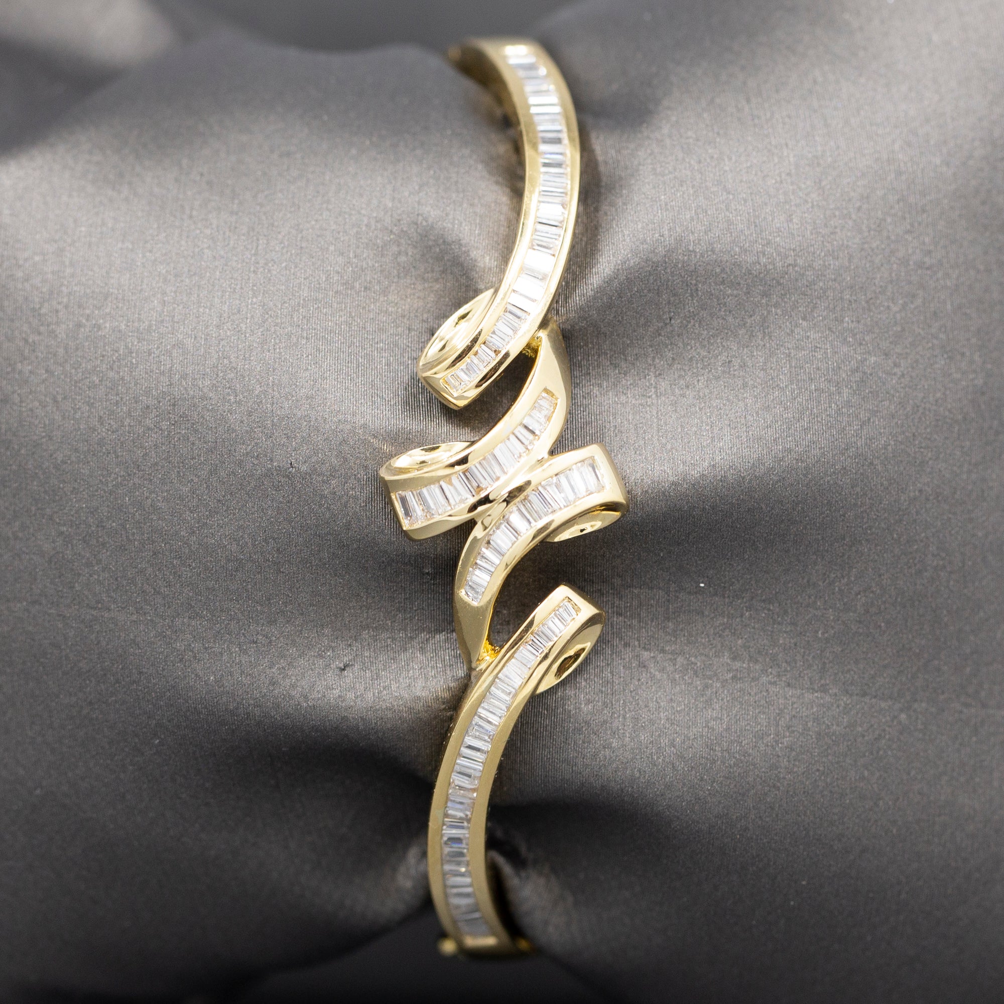 Elegant Baguette Cut Diamond Channel Set Hinged Bangle Bracelet in 18k Yellow Gold