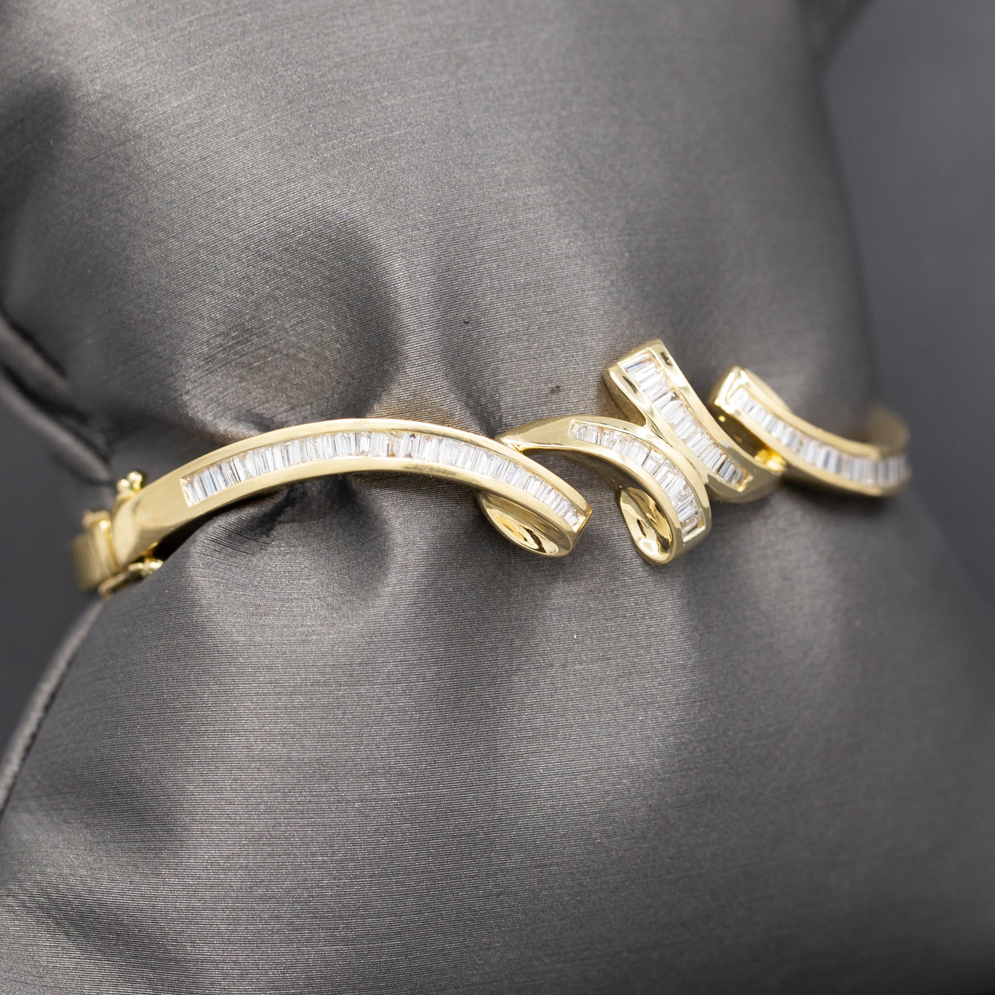 Elegant Baguette Cut Diamond Channel Set Hinged Bangle Bracelet in 18k Yellow Gold
