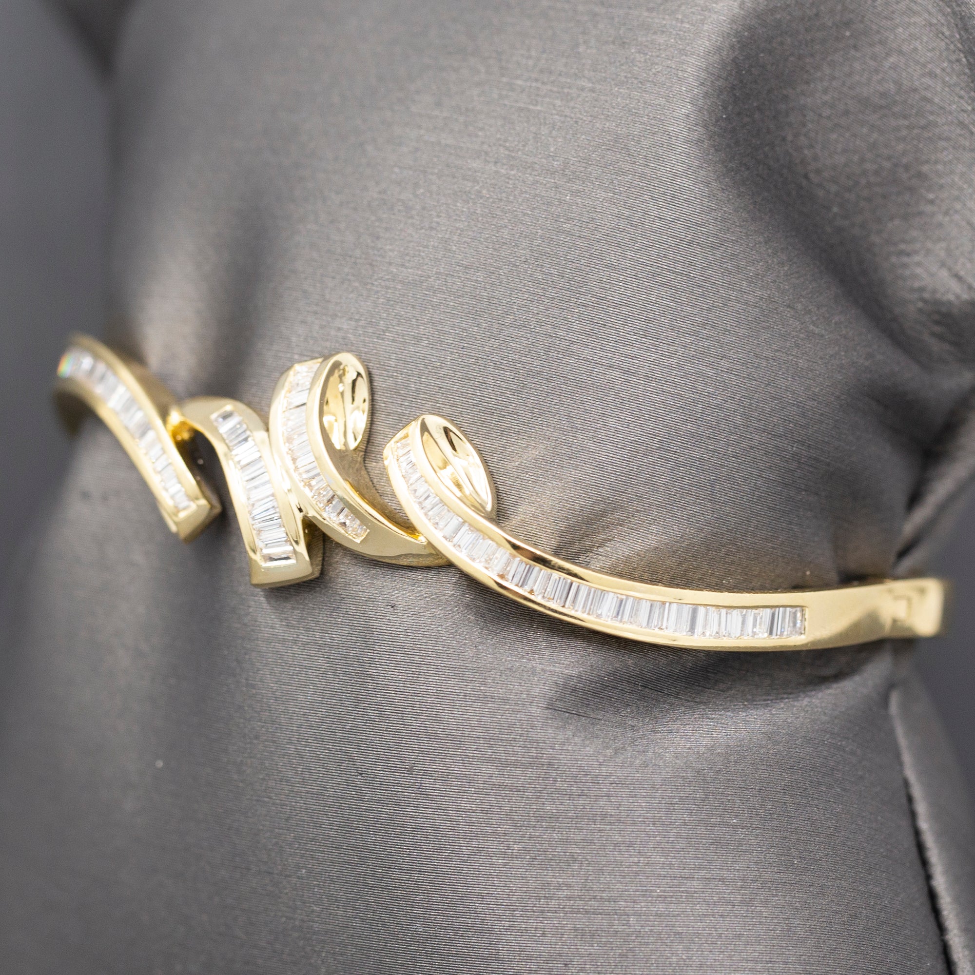 Elegant Baguette Cut Diamond Channel Set Hinged Bangle Bracelet in 18k Yellow Gold