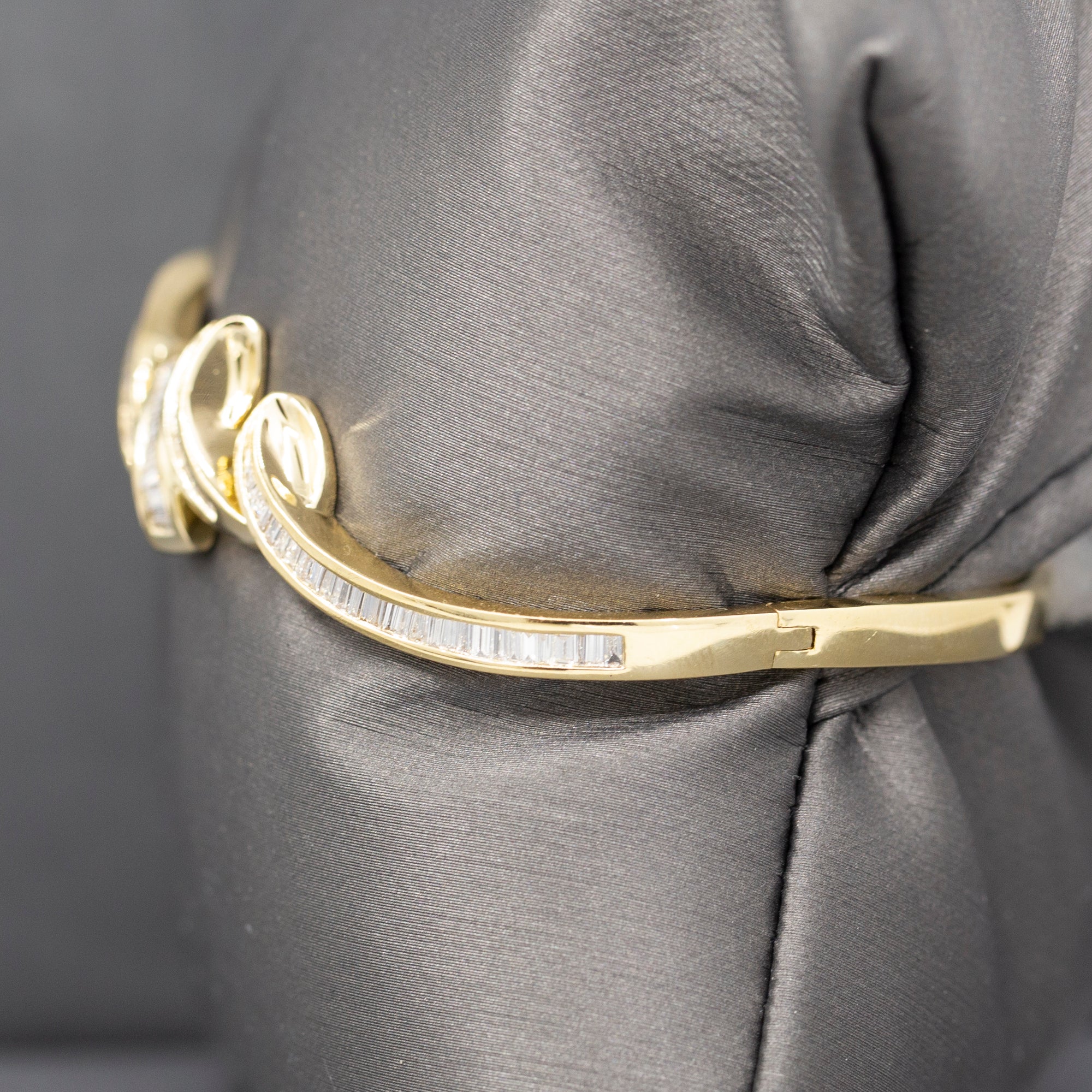 Elegant Baguette Cut Diamond Channel Set Hinged Bangle Bracelet in 18k Yellow Gold