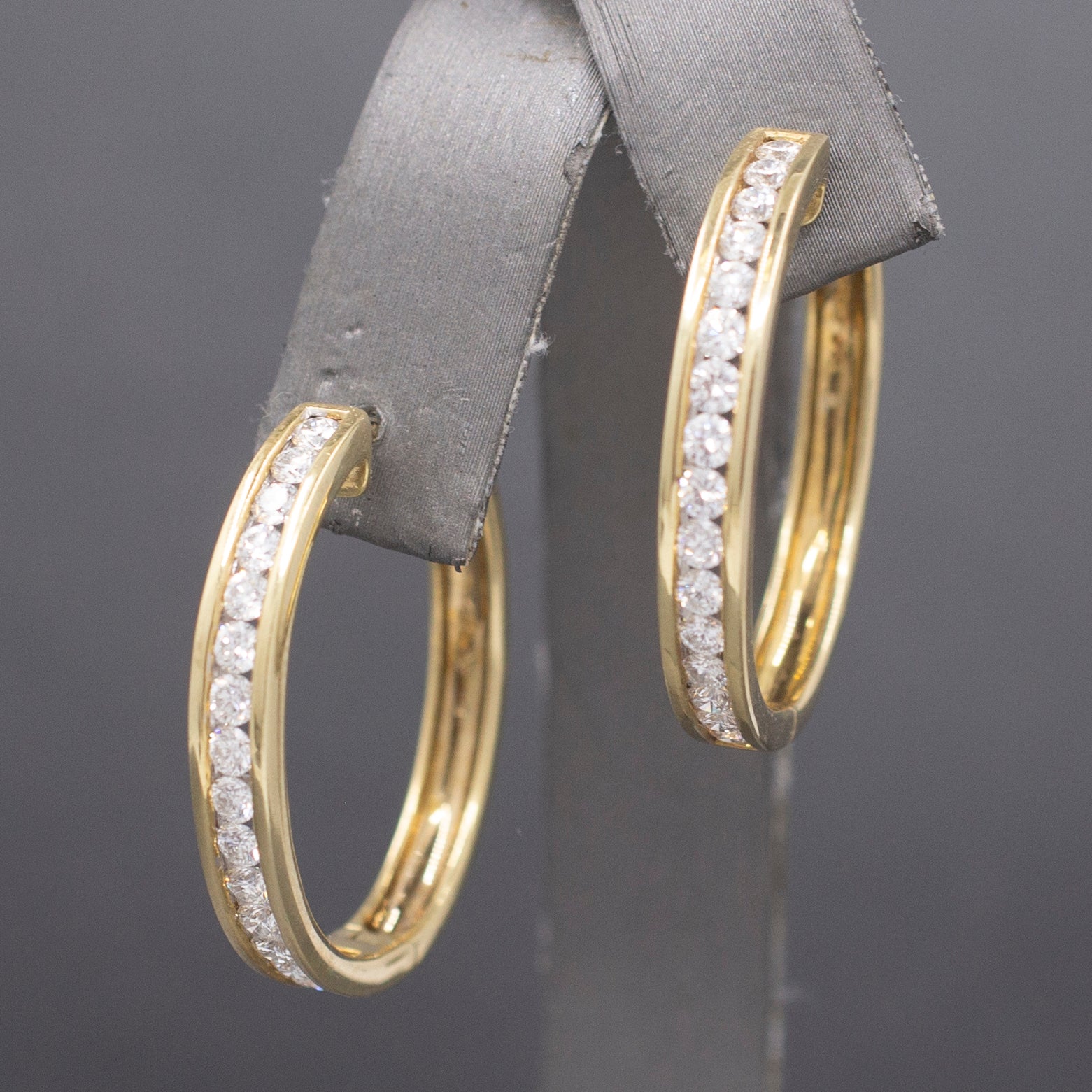 Sparkling Channel Set Diamond Oval Hoop Earrings in 14k Yellow Gold 1.95cttw