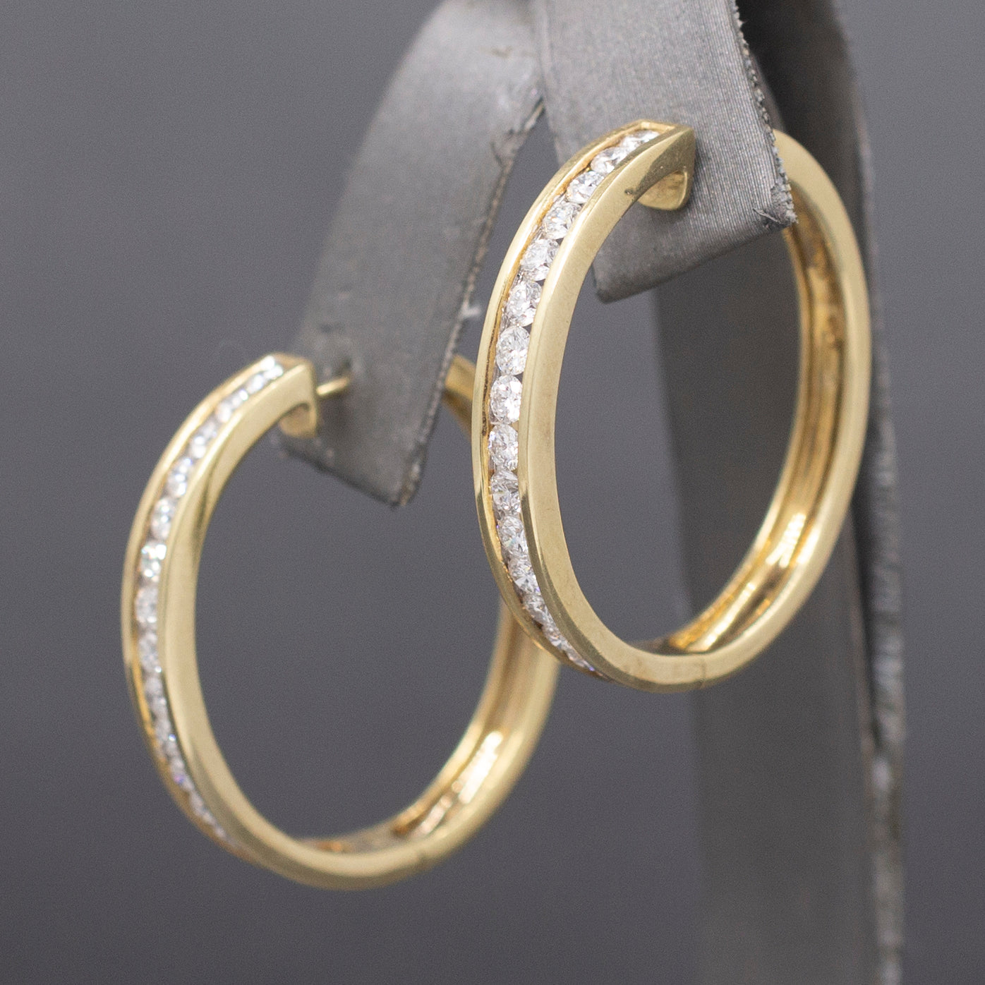 Sparkling Channel Set Diamond Oval Hoop Earrings in 14k Yellow Gold 1.95cttw