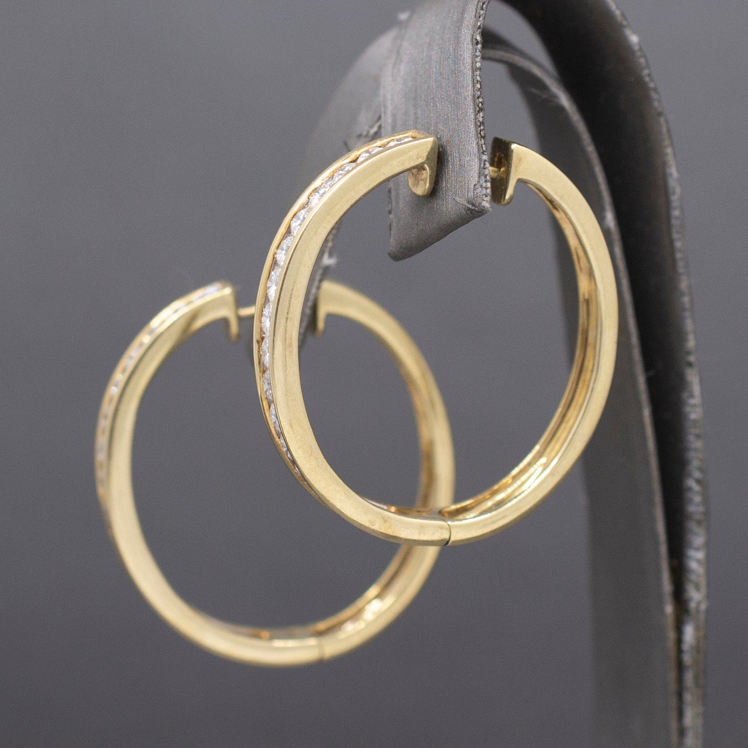 Sparkling Channel Set Diamond Oval Hoop Earrings in 14k Yellow Gold 1.95cttw