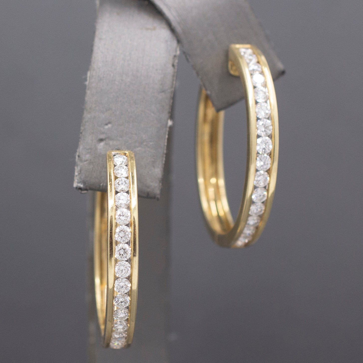 Sparkling Channel Set Diamond Oval Hoop Earrings in 14k Yellow Gold 1.95cttw