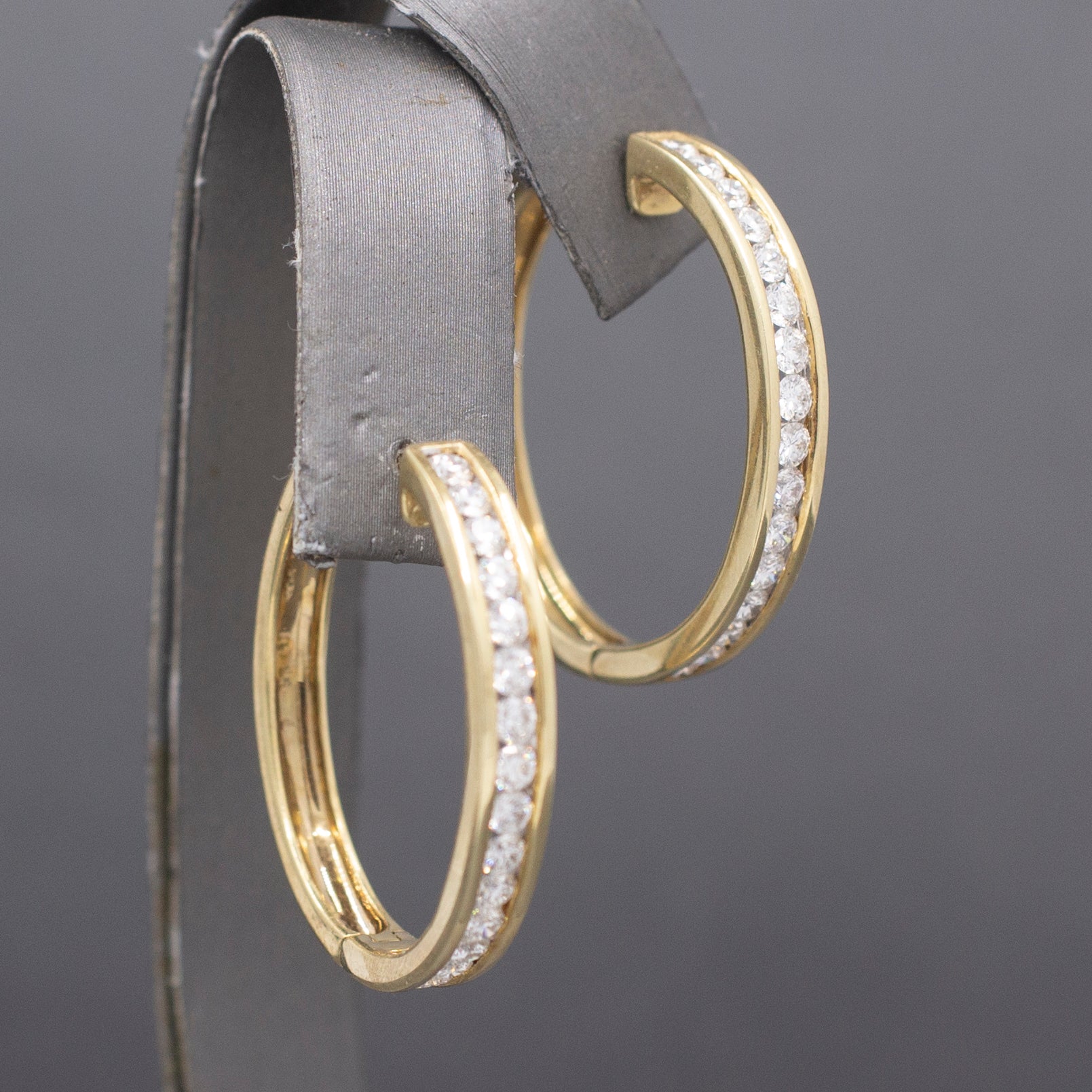 Sparkling Channel Set Diamond Oval Hoop Earrings in 14k Yellow Gold 1.95cttw