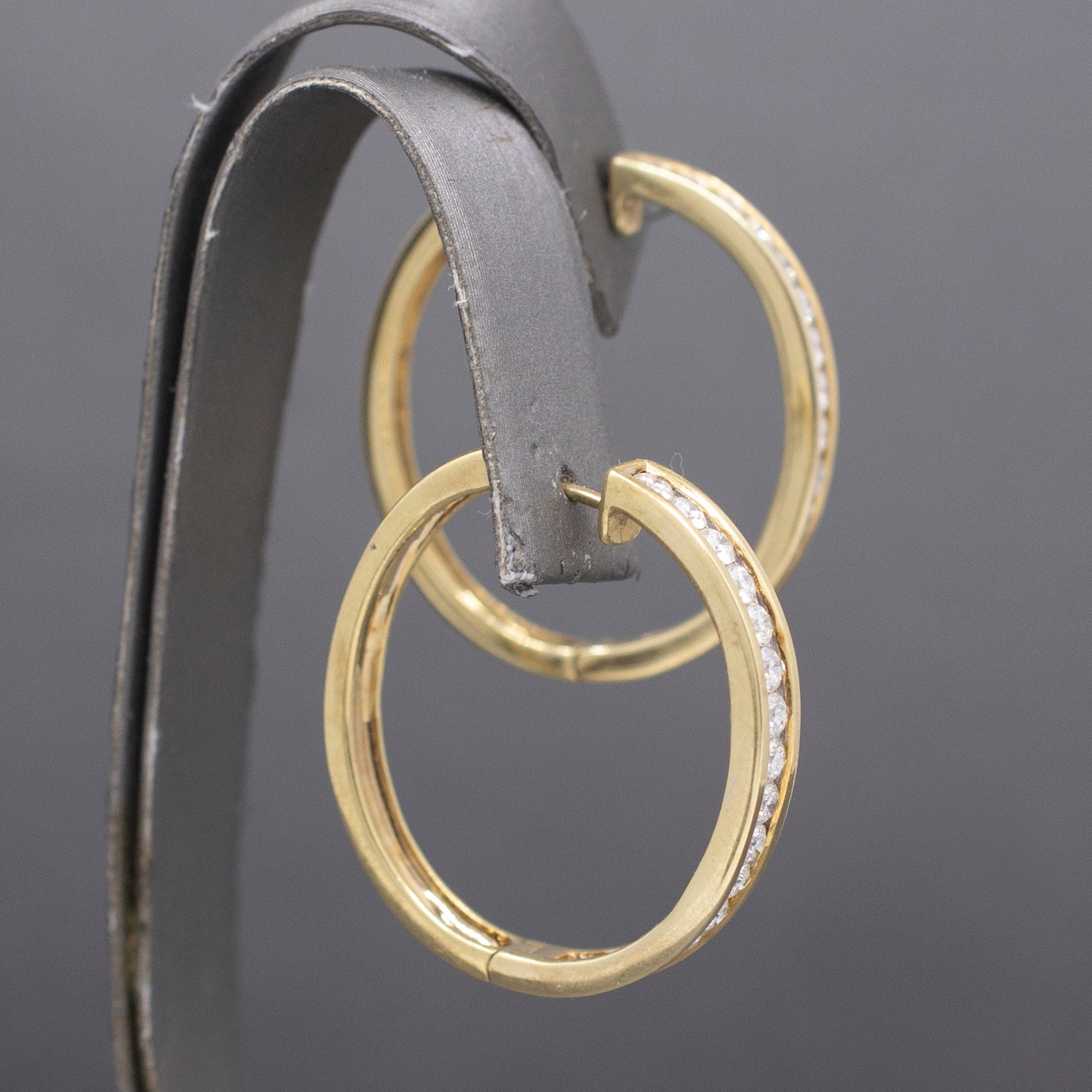 Sparkling Channel Set Diamond Oval Hoop Earrings in 14k Yellow Gold 1.95cttw