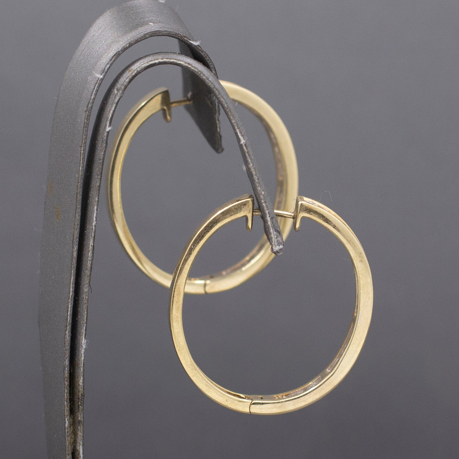 Sparkling Channel Set Diamond Oval Hoop Earrings in 14k Yellow Gold 1.95cttw