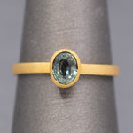 Handcrafted Bezel Set Oval Teal Green Sapphire Solitaire Ring in 18k Yellow Gold