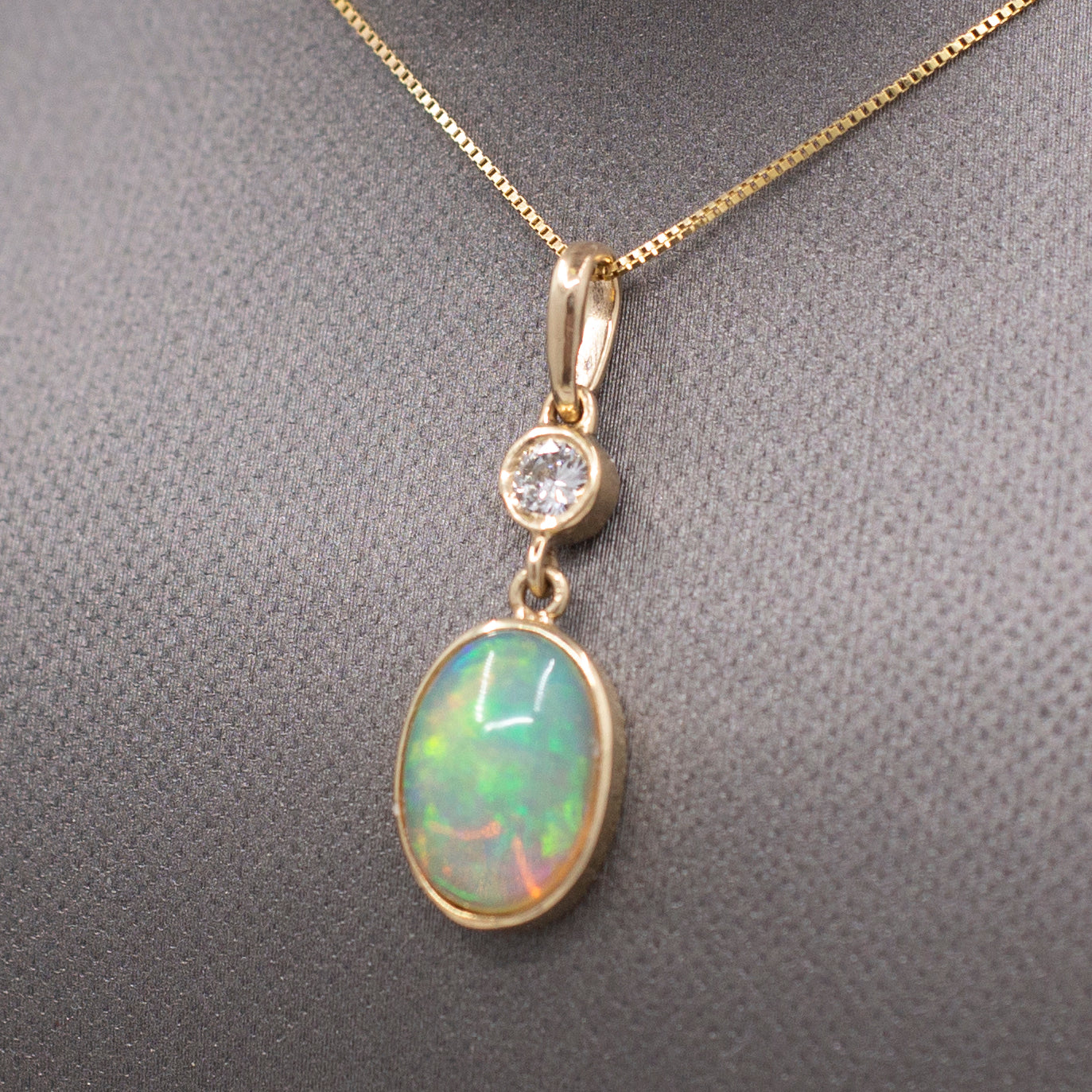 Exquisite Ethiopian Opal and Diamond Bezel Set Pendant Necklace in 14k Yellow Gold