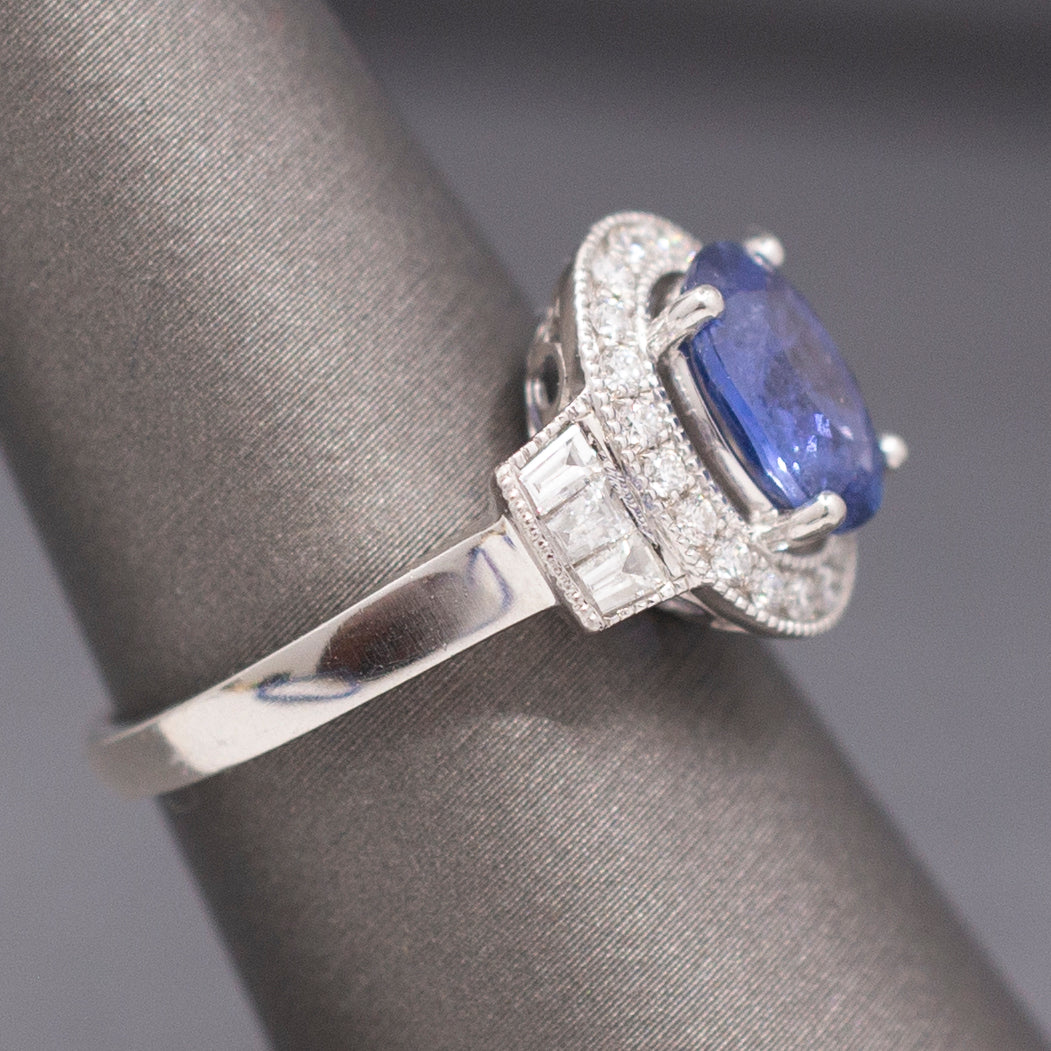 Vintage Oval Blue Sapphire with Round and Baguette Diamond Ring in Platinum