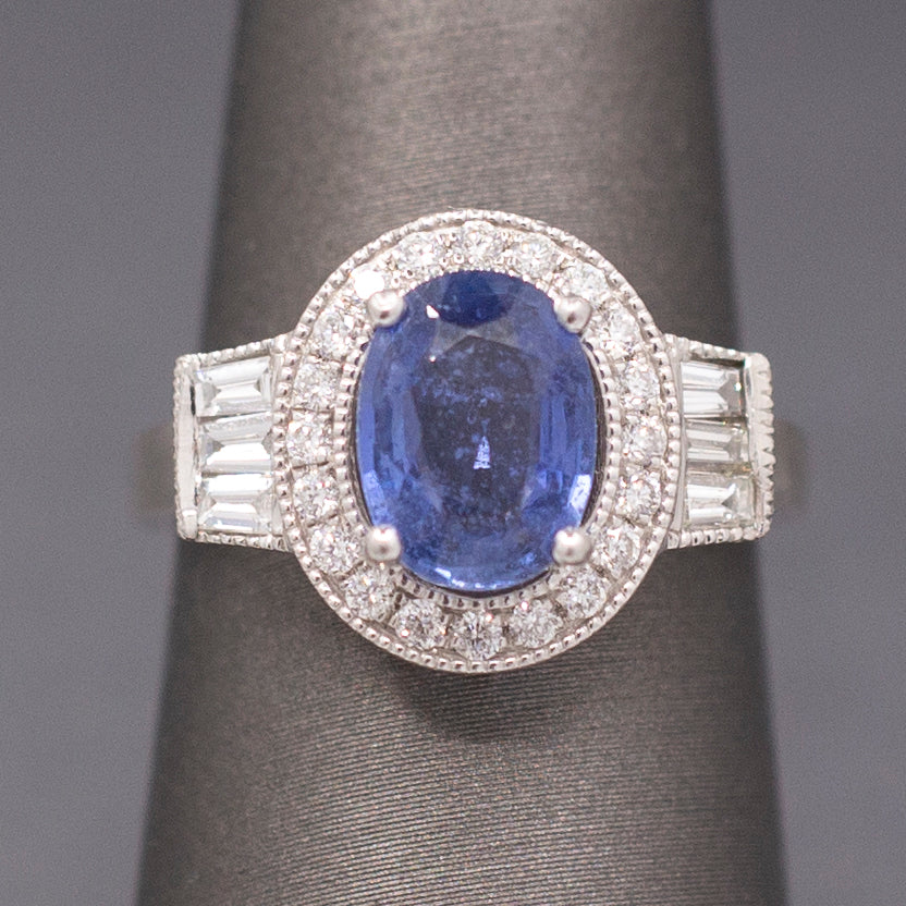Vintage Oval Blue Sapphire with Round and Baguette Diamond Ring in Platinum