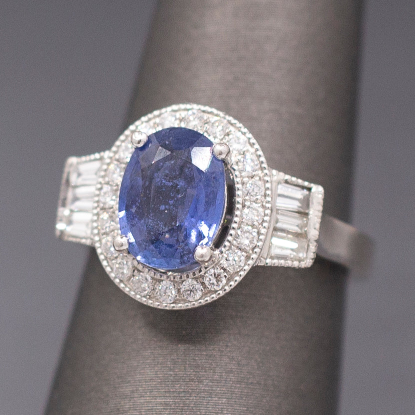 Vintage Oval Blue Sapphire with Round and Baguette Diamond Ring in Platinum
