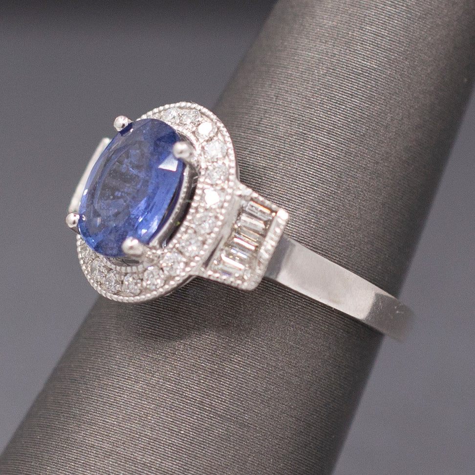 Vintage Oval Blue Sapphire with Round and Baguette Diamond Ring in Platinum