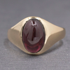 Vintage Oval Garnet Cabochon Flush Set Ring in 10k Yellow Gold