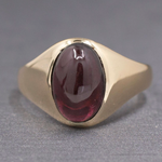 Vintage Oval Garnet Cabochon Flush Set Ring in 10k Yellow Gold