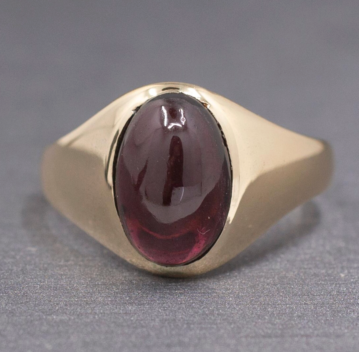 Vintage Oval Garnet Cabochon Flush Set Ring in 10k Yellow Gold
