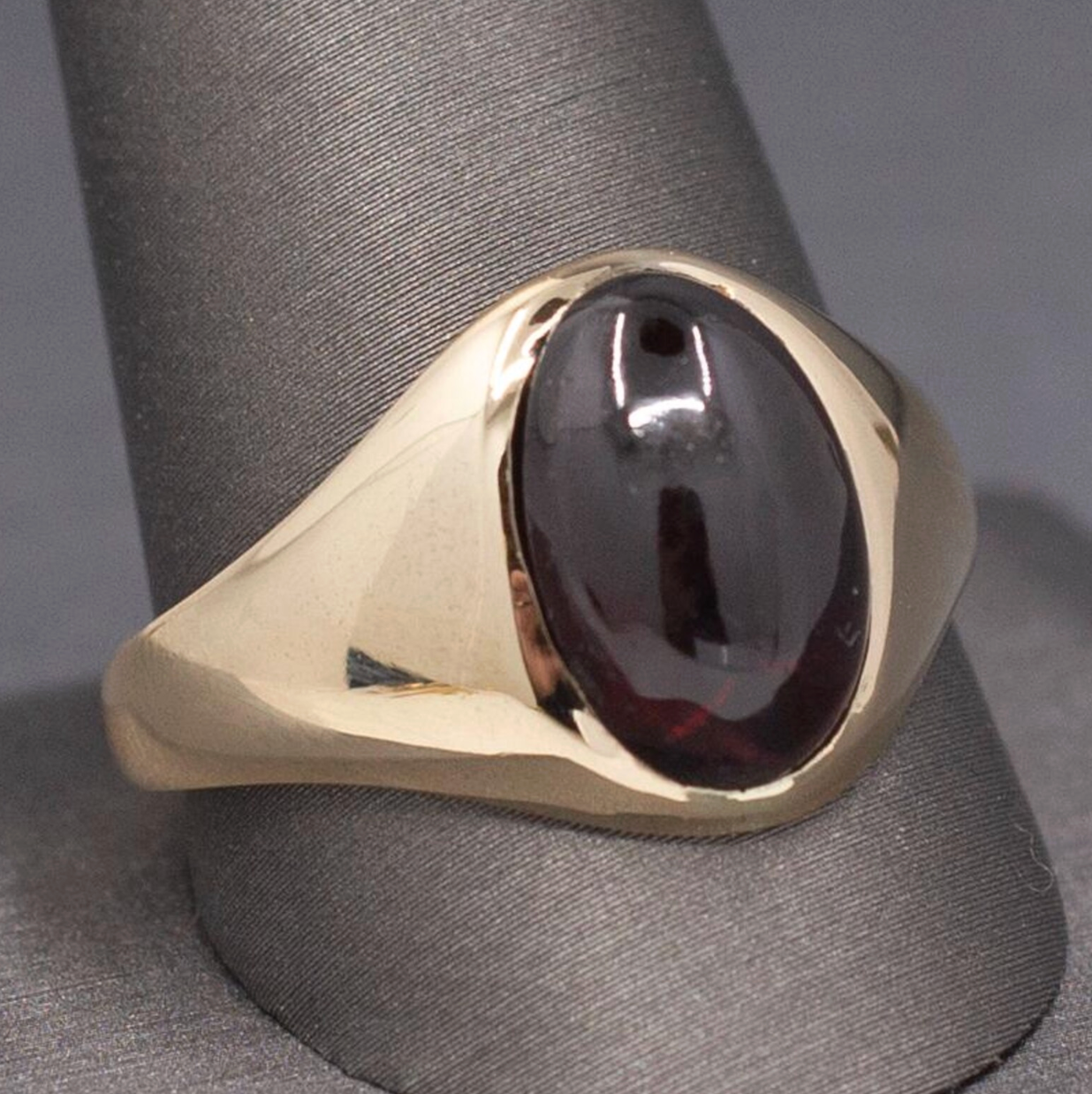 Vintage Oval Garnet Cabochon Flush Set Ring in 10k Yellow Gold