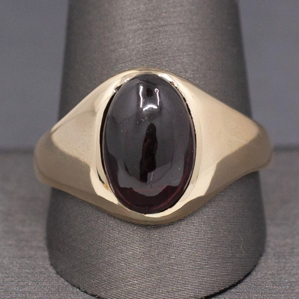 Vintage Oval Garnet Cabochon Flush Set Ring in 10k Yellow Gold