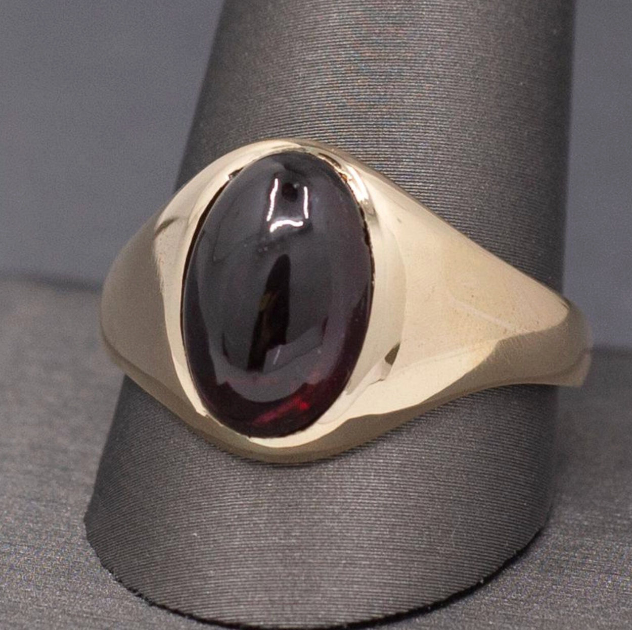 Vintage Oval Garnet Cabochon Flush Set Ring in 10k Yellow Gold