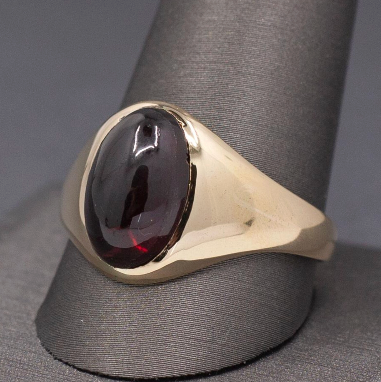 Vintage Oval Garnet Cabochon Flush Set Ring in 10k Yellow Gold