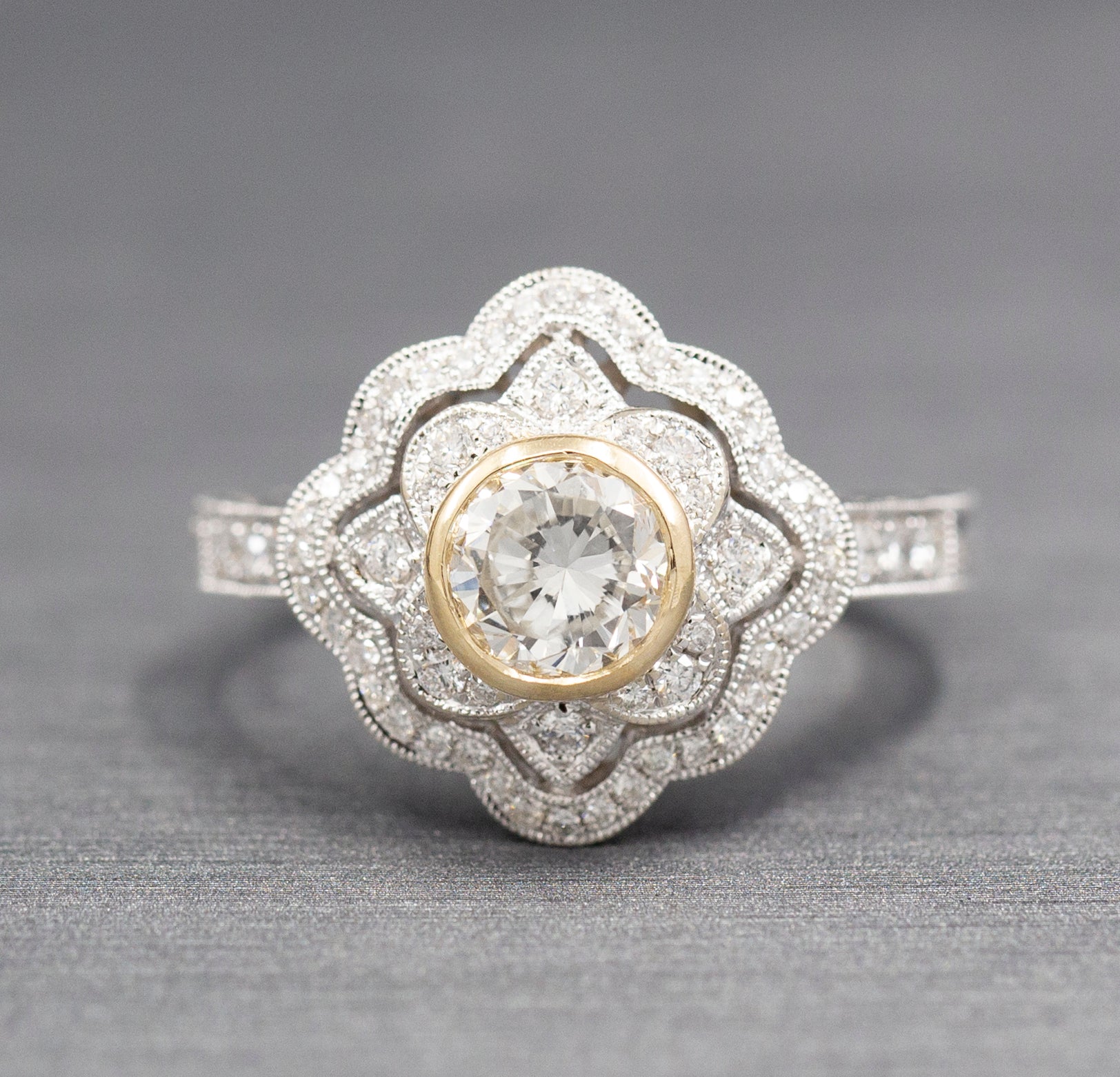 Vintage Style Bezel Set Diamond Engagement Ring with Engraved Band in 14k Yellow and White Gold