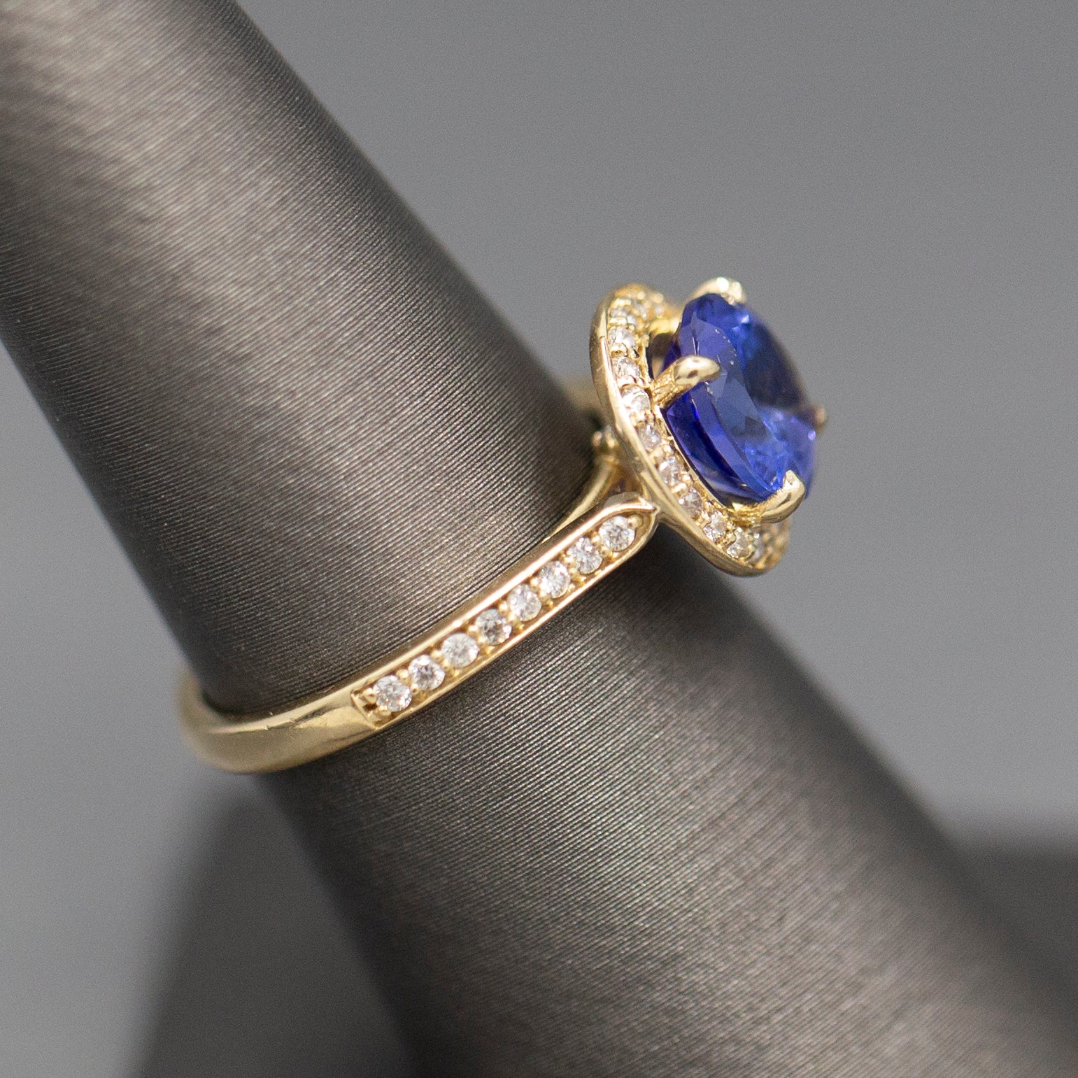 Handcrafted Brilliant Tanzanite and Diamond Halo Ring in 14k Yellow Gold