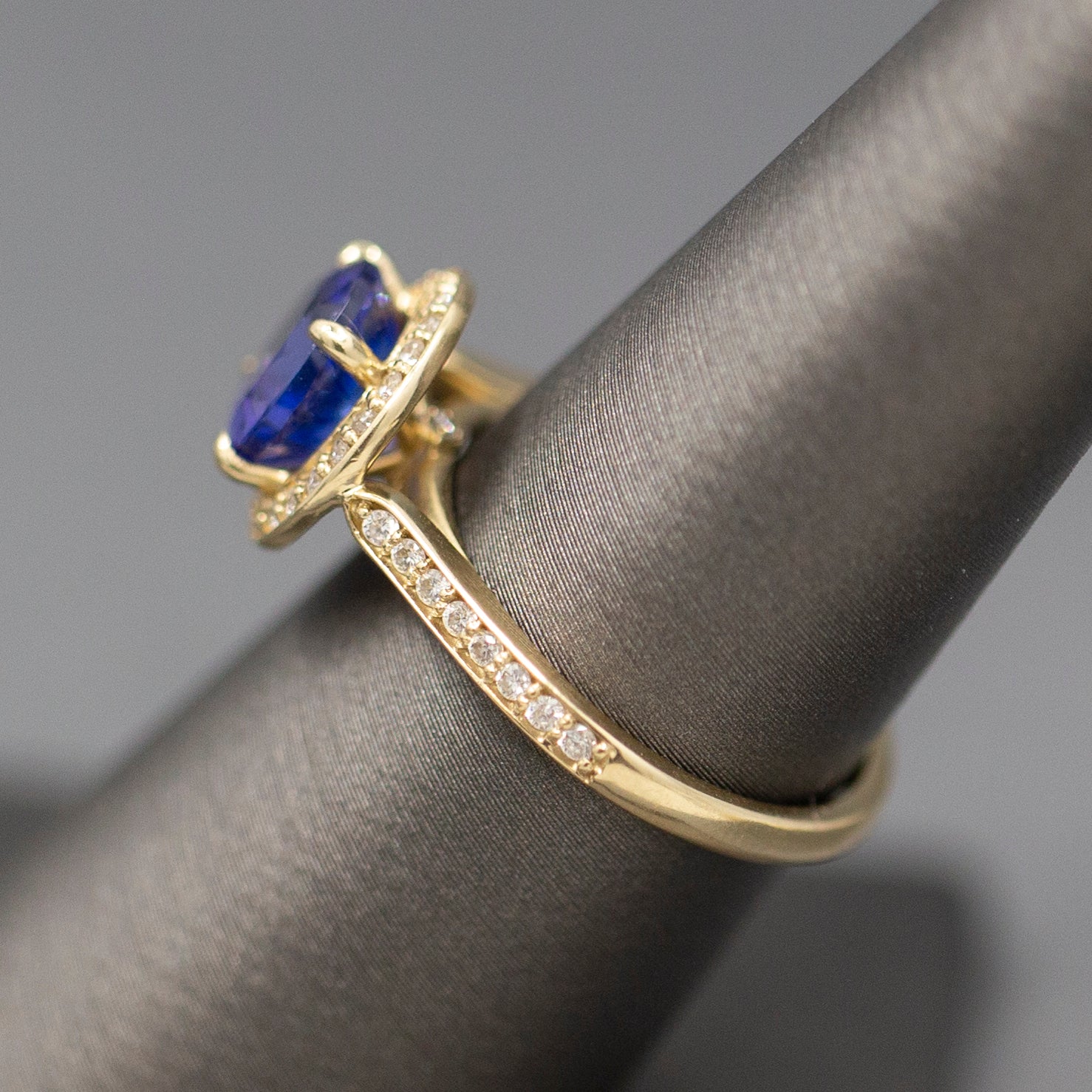 Handcrafted Brilliant Tanzanite and Diamond Halo Ring in 14k Yellow Gold
