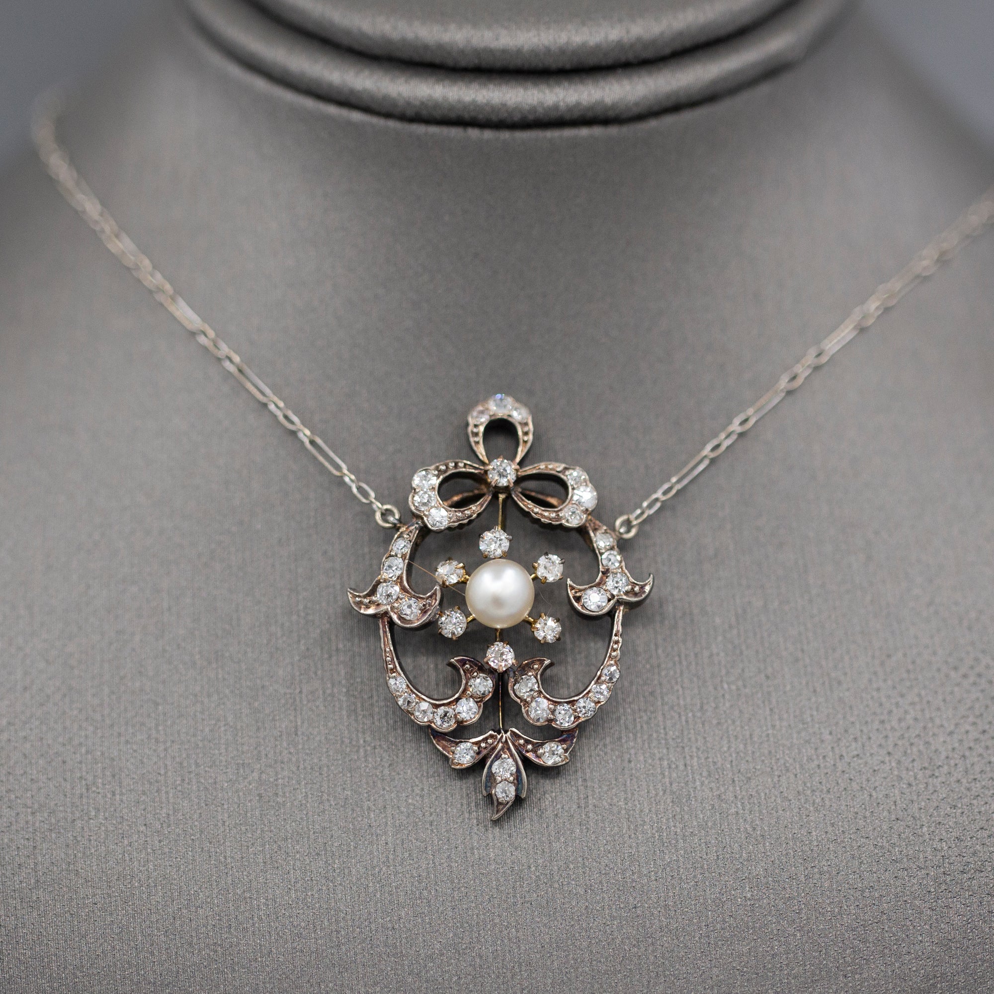 Exquisite Edwardian Natural Pearl and Diamond Bow Necklace in 14k White and Yellow Gold