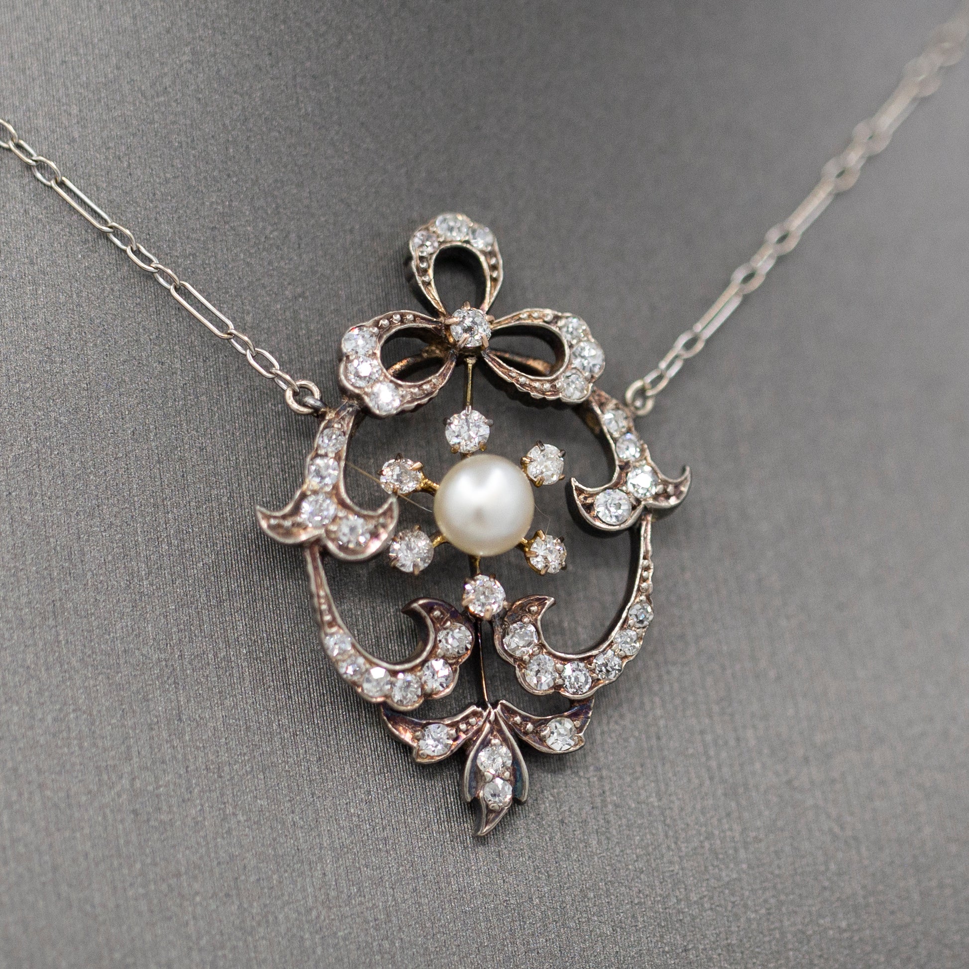 Exquisite Edwardian Natural Pearl and Diamond Bow Necklace in 14k White and Yellow Gold