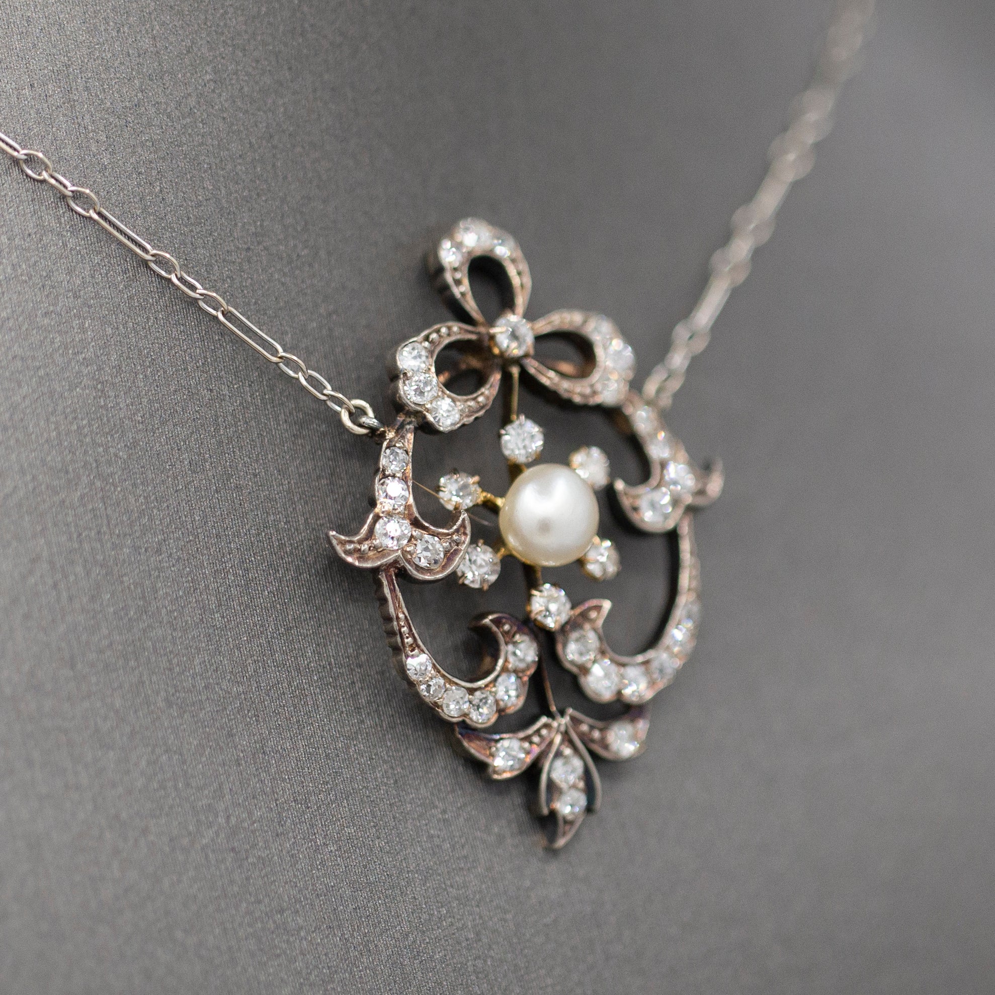 Exquisite Edwardian Natural Pearl and Diamond Bow Necklace in 14k White and Yellow Gold