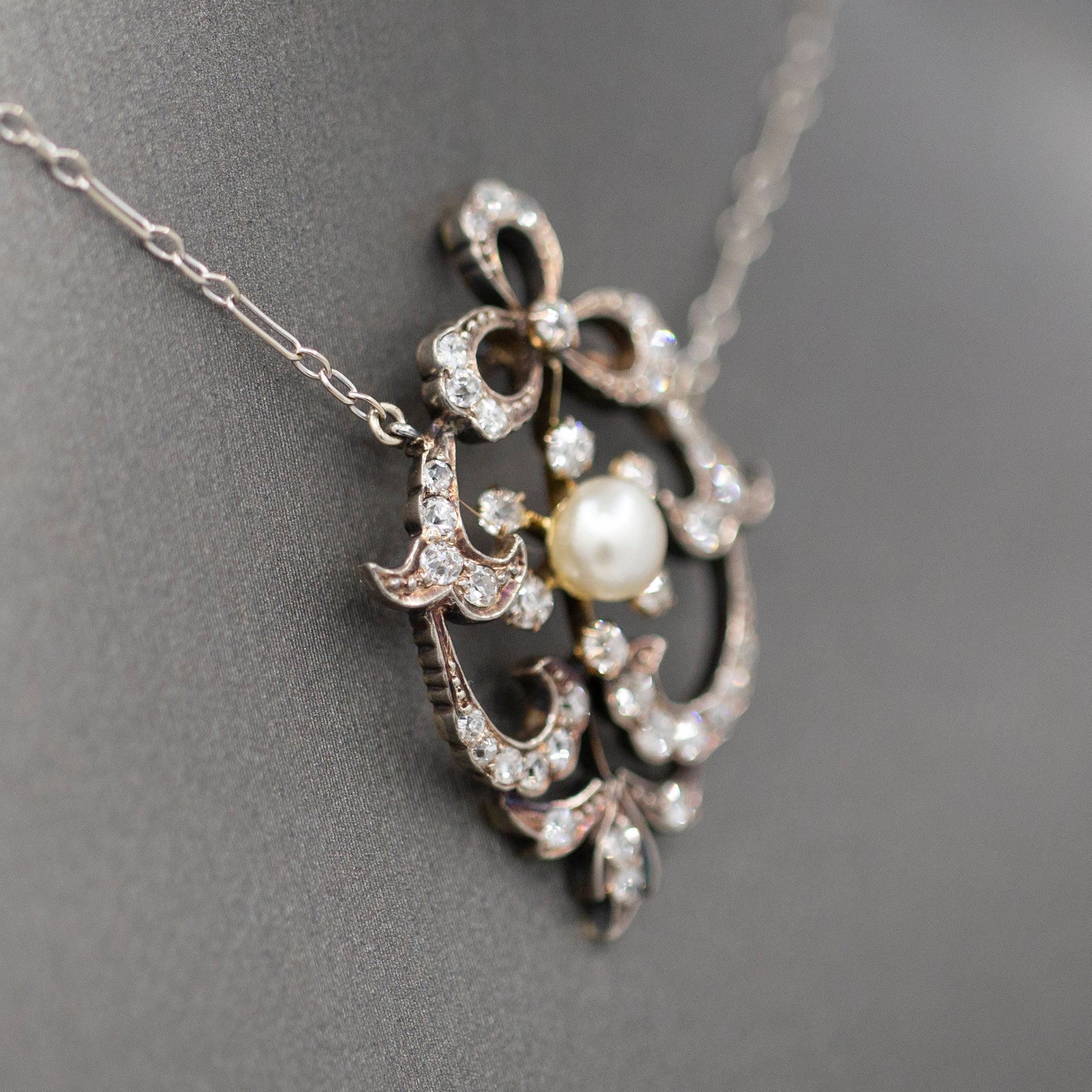 Exquisite Edwardian Natural Pearl and Diamond Bow Necklace in 14k White and Yellow Gold