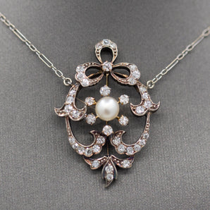 Exquisite Edwardian Natural Pearl and Diamond Bow Necklace in 14k White and Yellow Gold