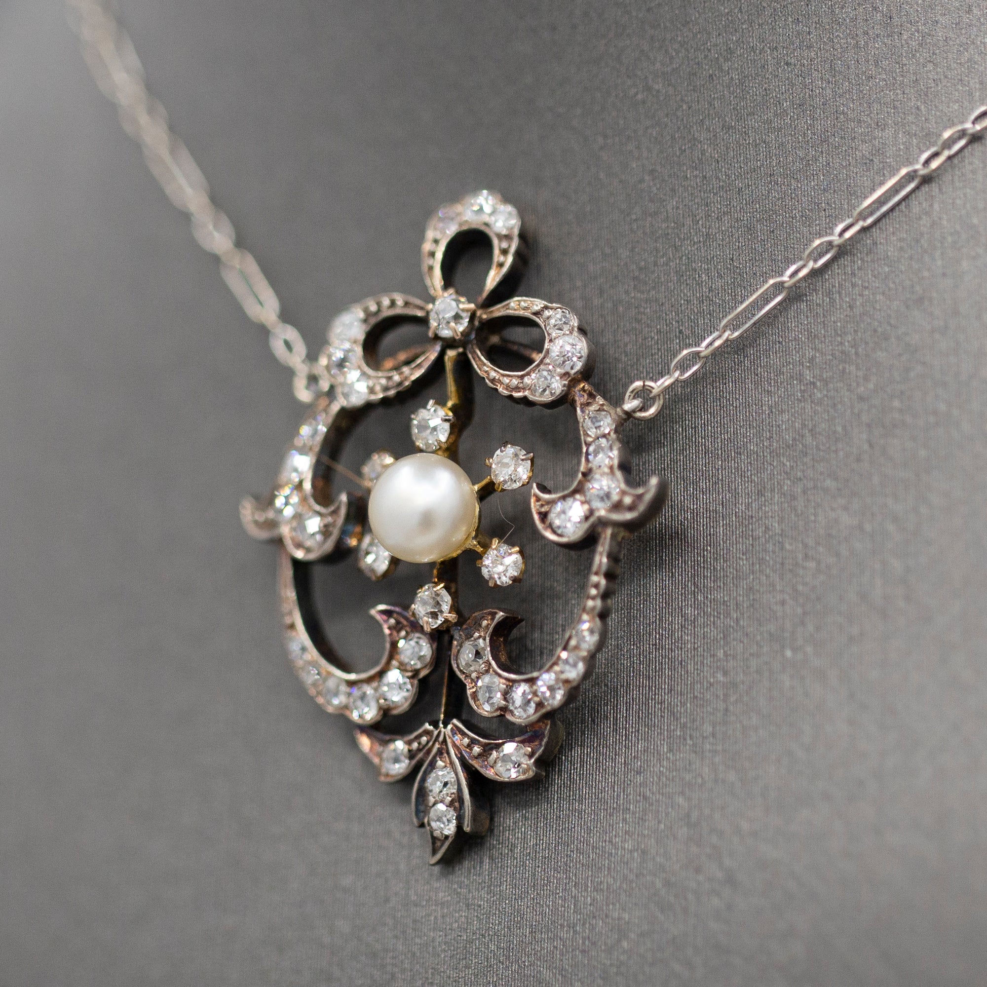 Exquisite Edwardian Natural Pearl and Diamond Bow Necklace in 14k White and Yellow Gold