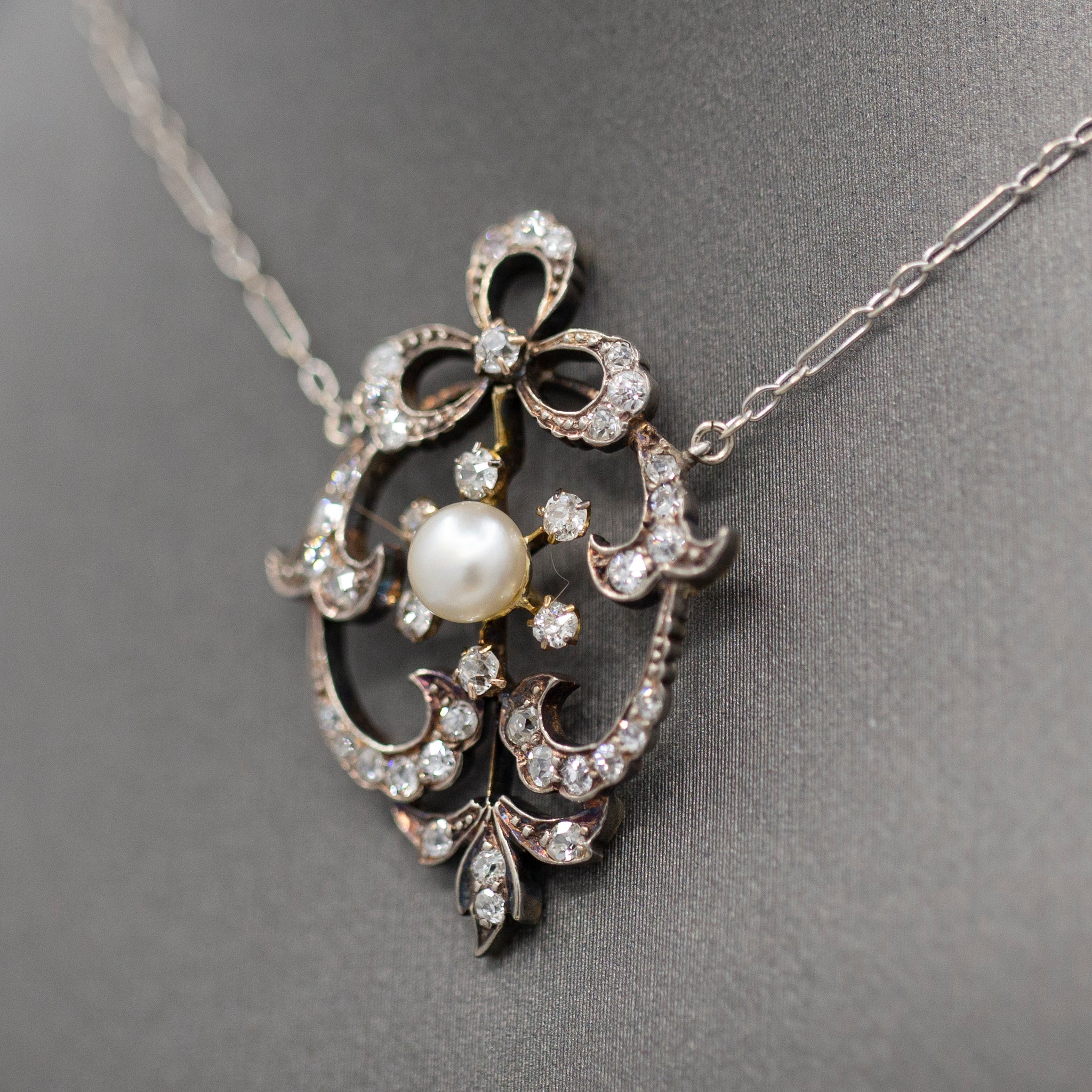 Exquisite Edwardian Natural Pearl and Diamond Bow Necklace in 14k White and Yellow Gold