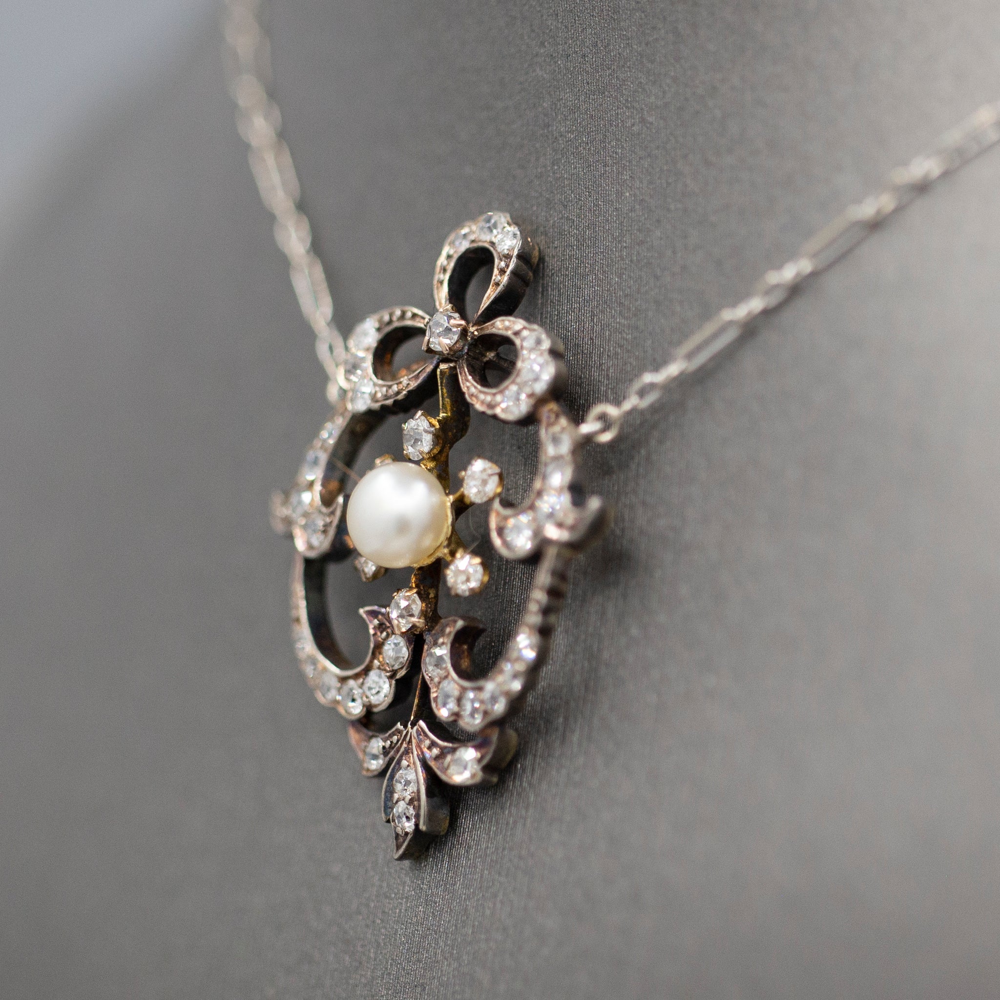 Exquisite Edwardian Natural Pearl and Diamond Bow Necklace in 14k White and Yellow Gold