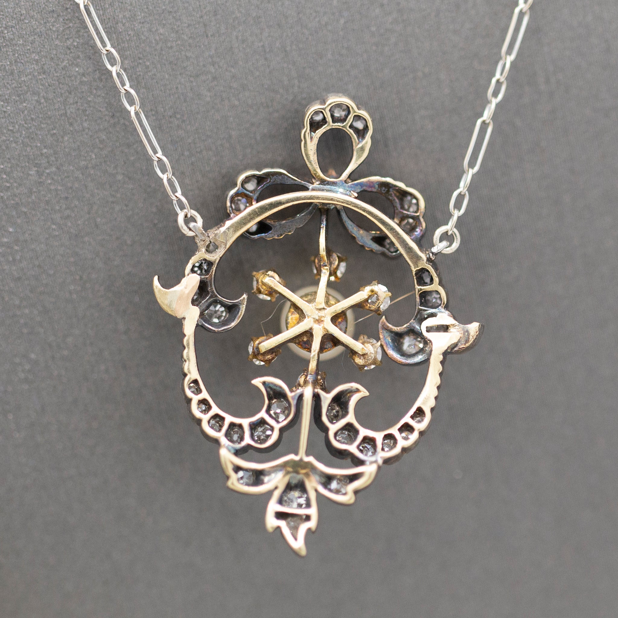 Exquisite Edwardian Natural Pearl and Diamond Bow Necklace in 14k White and Yellow Gold