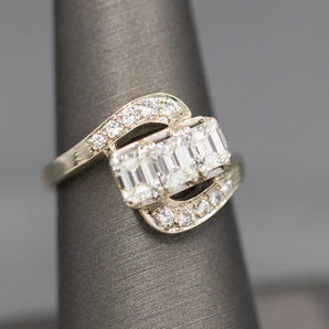 Brilliant Three Stone Emerald Cut Diamond Swirl Bypass Ring in 14k White Gold