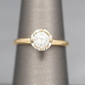 Feminine Round Brilliant Cut Diamond Solitaire Engagement Ring with Illusion Head in 14k Yellow Gold