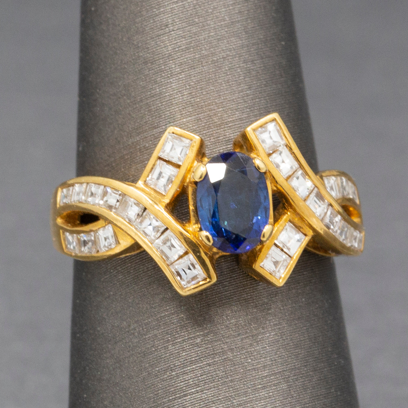 Sparkling Oval Cut Blue Sapphire and French Cut Carre' Diamond Ring in 18k Yellow Gold