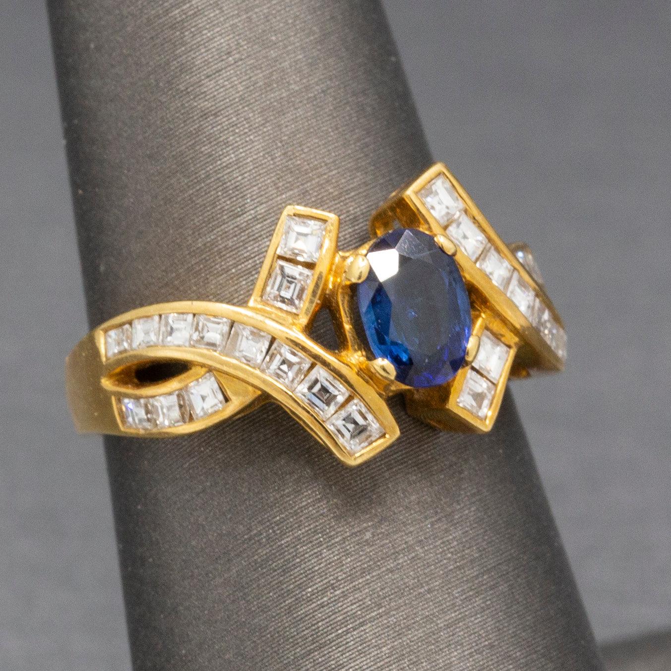 Sparkling Oval Cut Blue Sapphire and French Cut Carre' Diamond Ring in 18k Yellow Gold