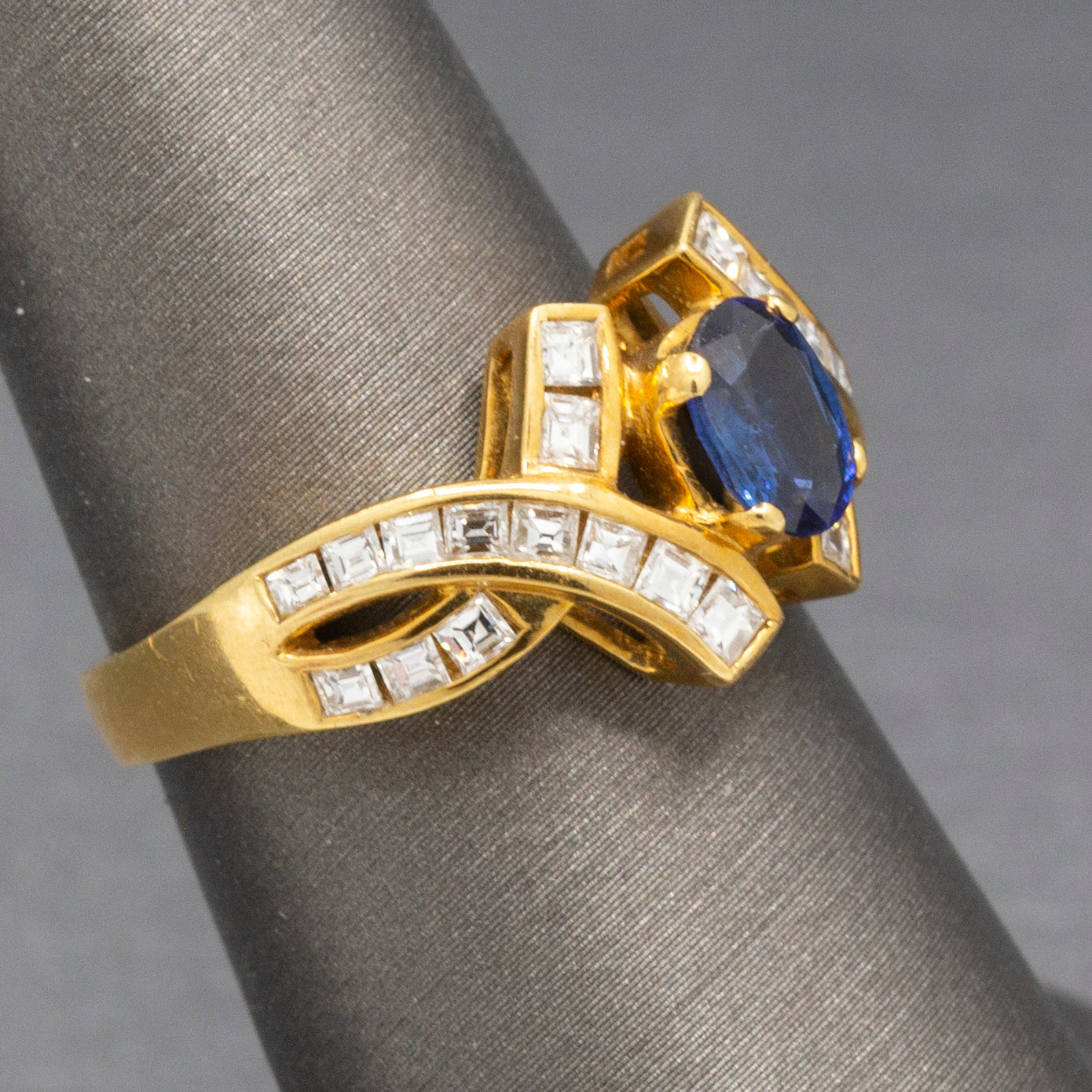 Sparkling Oval Cut Blue Sapphire and French Cut Carre' Diamond Ring in 18k Yellow Gold