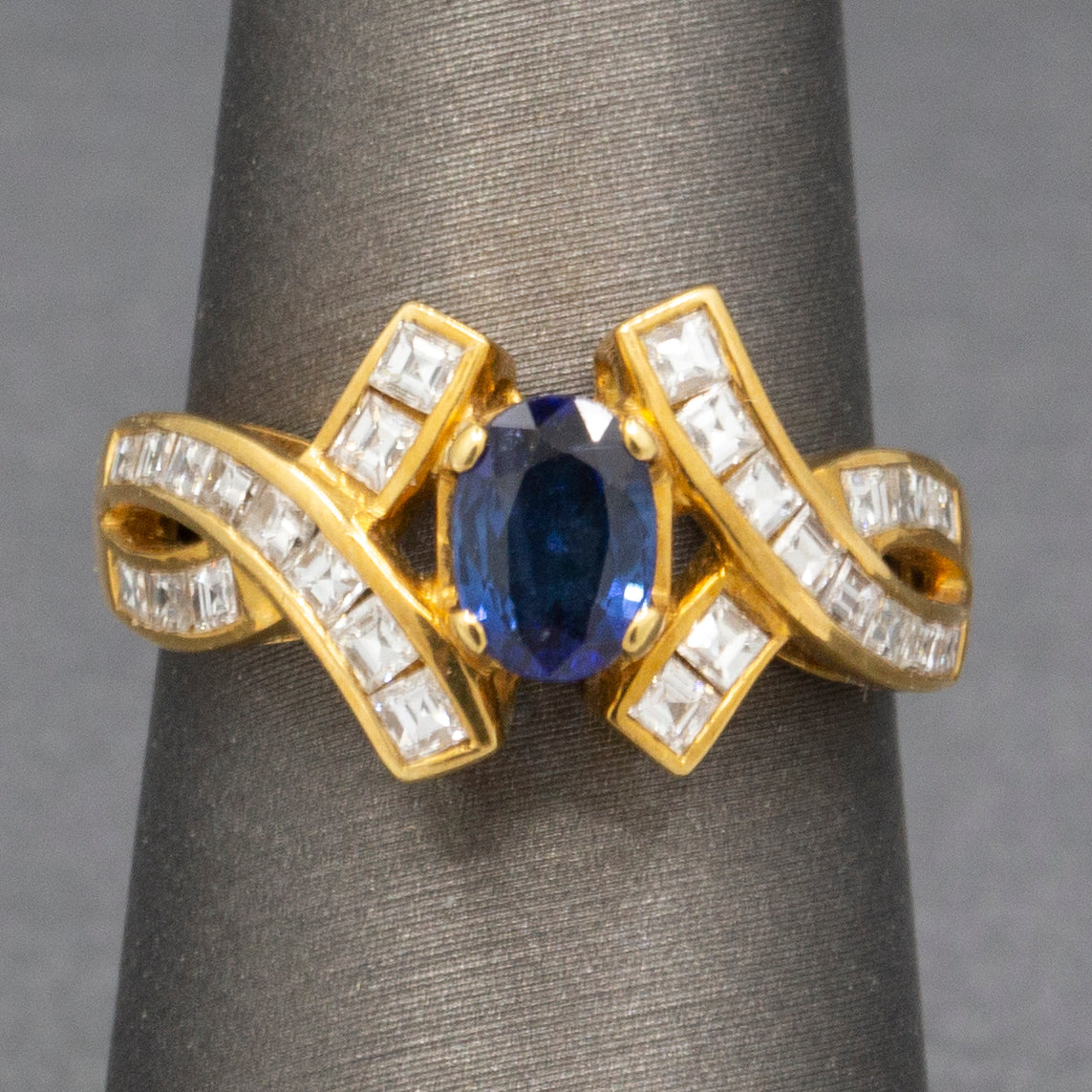 Sparkling Oval Cut Blue Sapphire and French Cut Carre' Diamond Ring in 18k Yellow Gold