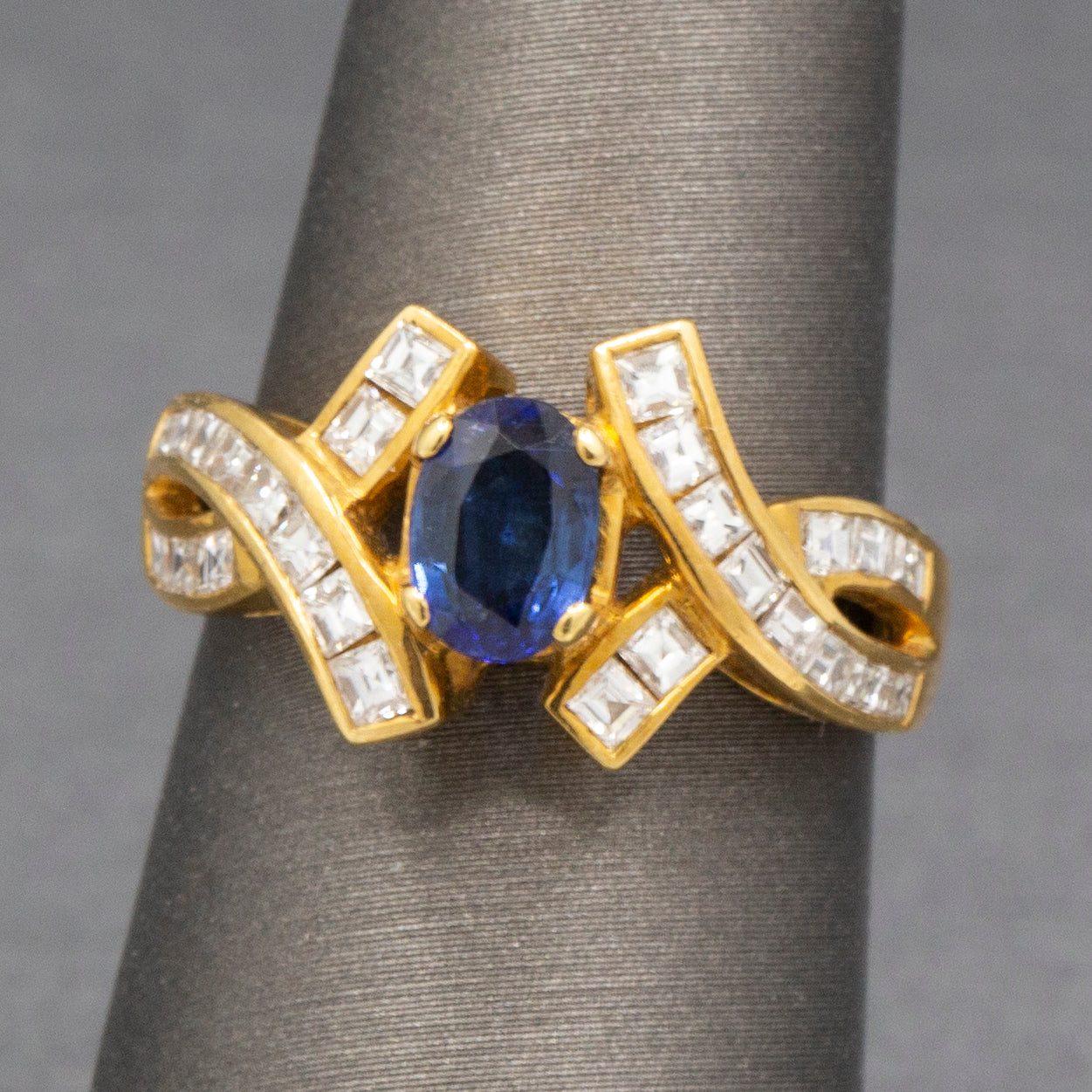 Sparkling Oval Cut Blue Sapphire and French Cut Carre' Diamond Ring in 18k Yellow Gold
