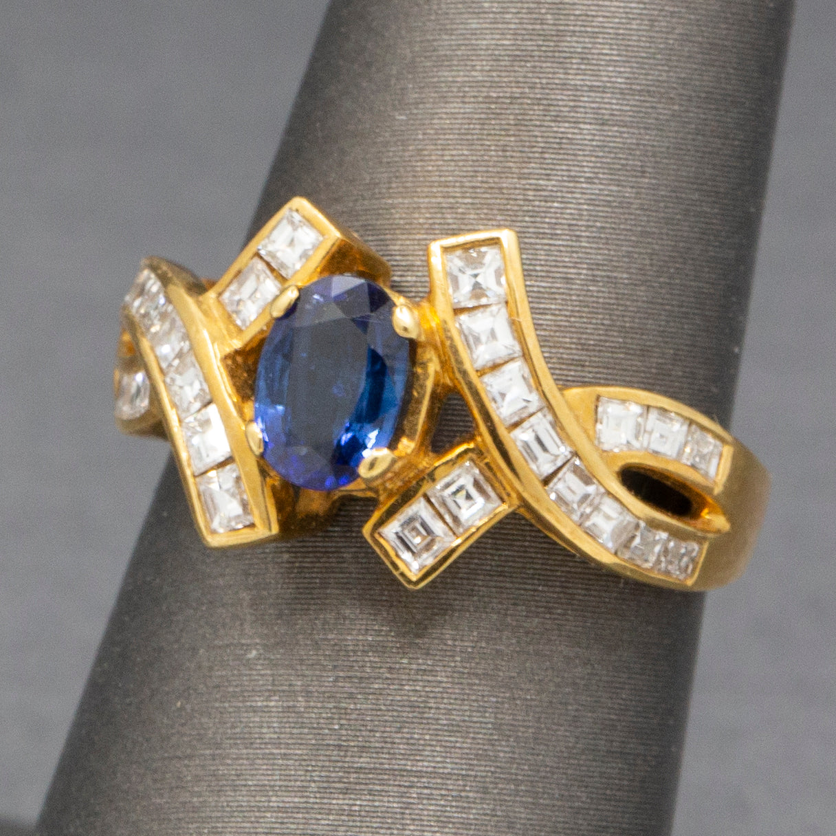 Sparkling Oval Cut Blue Sapphire and French Cut Carre' Diamond Ring in 18k Yellow Gold