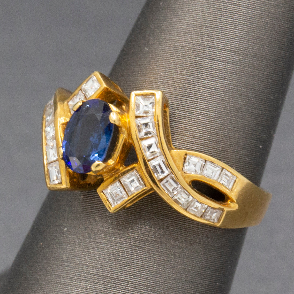 Sparkling Oval Cut Blue Sapphire and French Cut Carre' Diamond Ring in 18k Yellow Gold